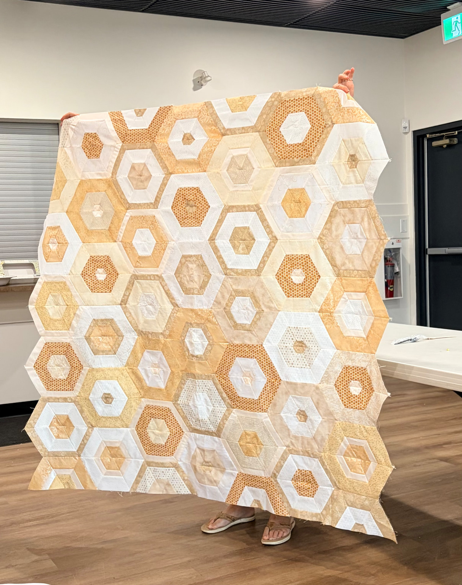 Honeycomb hexagon quilt top in cream, butter, and honey golds