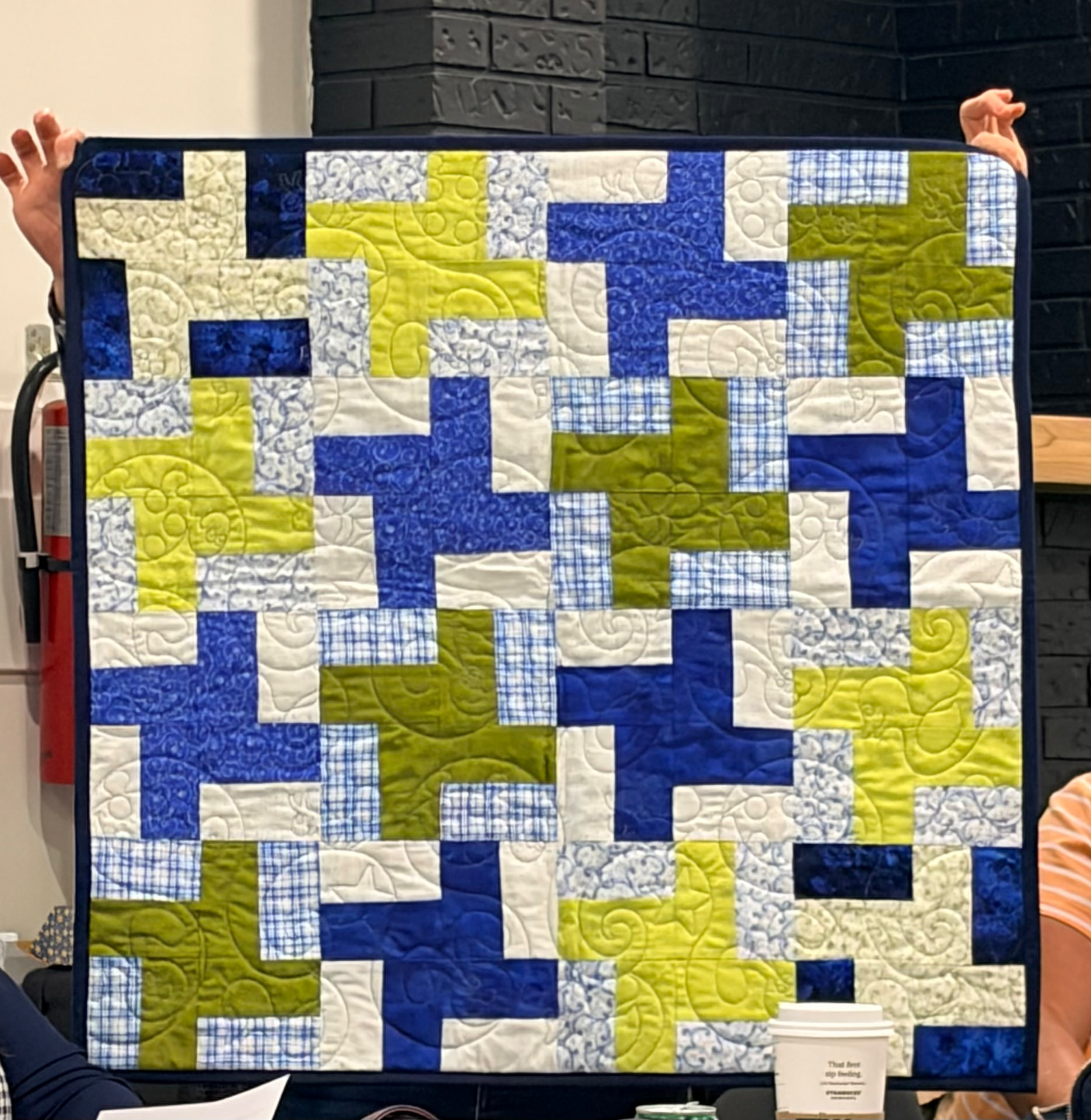Blue and green cross quilt in soft batik prints