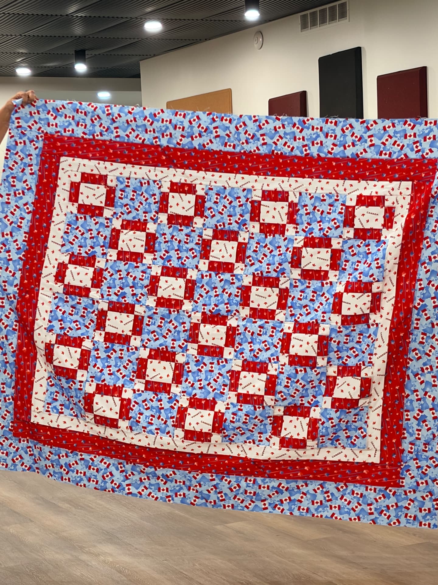 Canada flag quilt in red, white, and blue with multiple borders