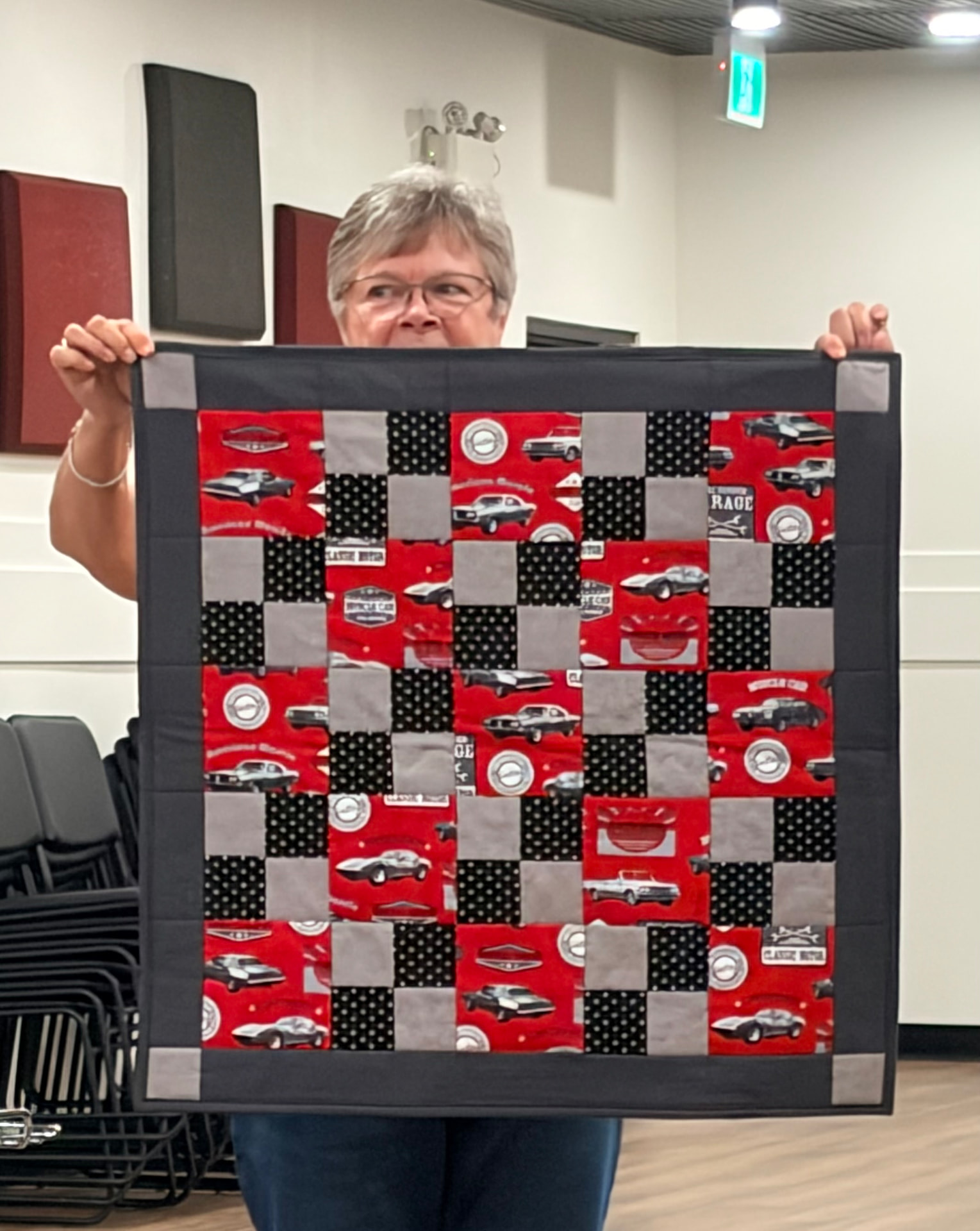 Classic car quilt in red, grey, and black with checkerboard blocks