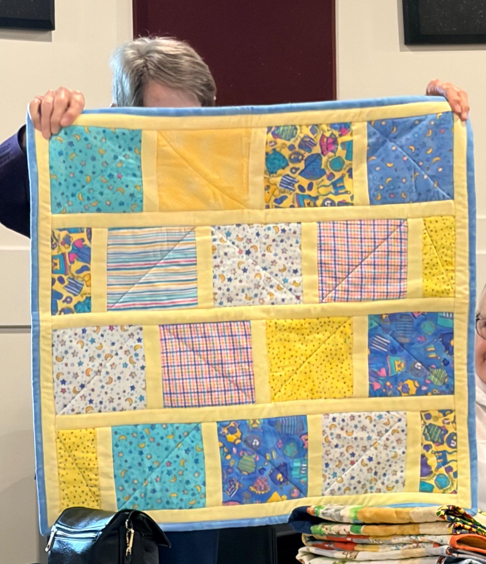 Multicolour strip-pieced quilt with bold geometric prints