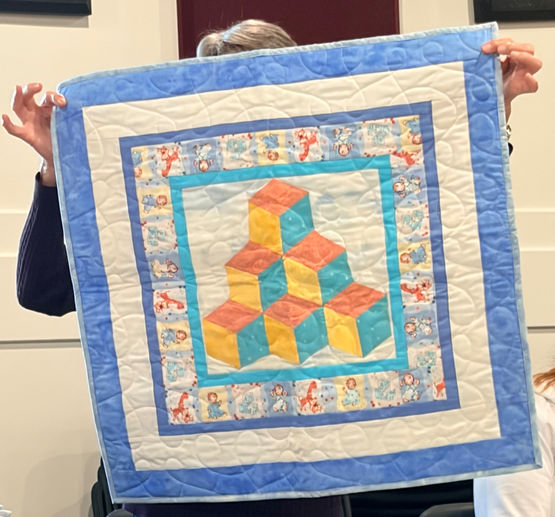 Tumbling blocks baby quilt in pastel prints